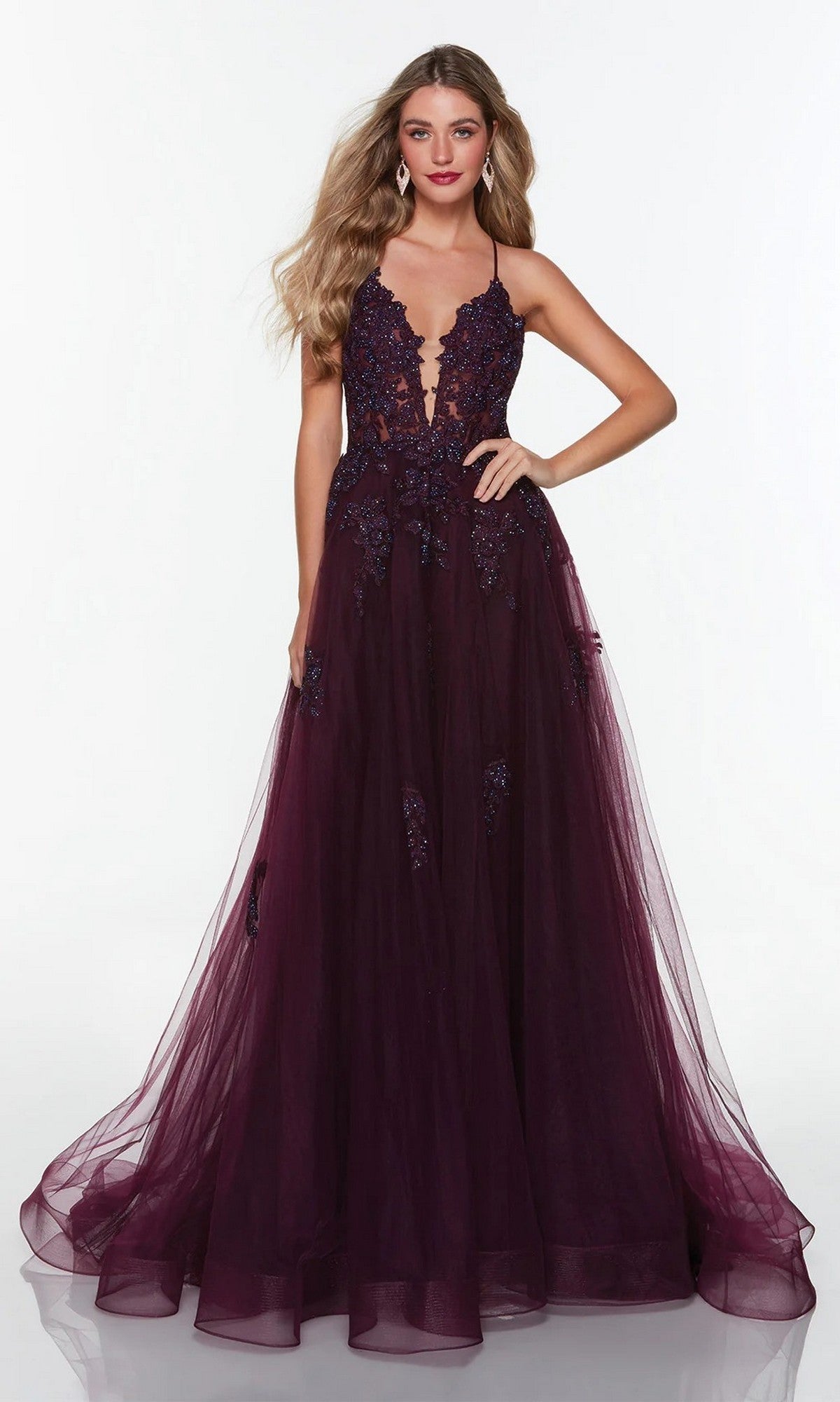 A woman wearing the Long Formal Dress: Alyce 61263 in rosewood, featuring a lace bodice and flowing tulle skirt, stands against a plain white background.
